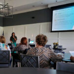 Stephanie Carreras speaking on retirement strategies for women at a seminar in Spring Hill, TN